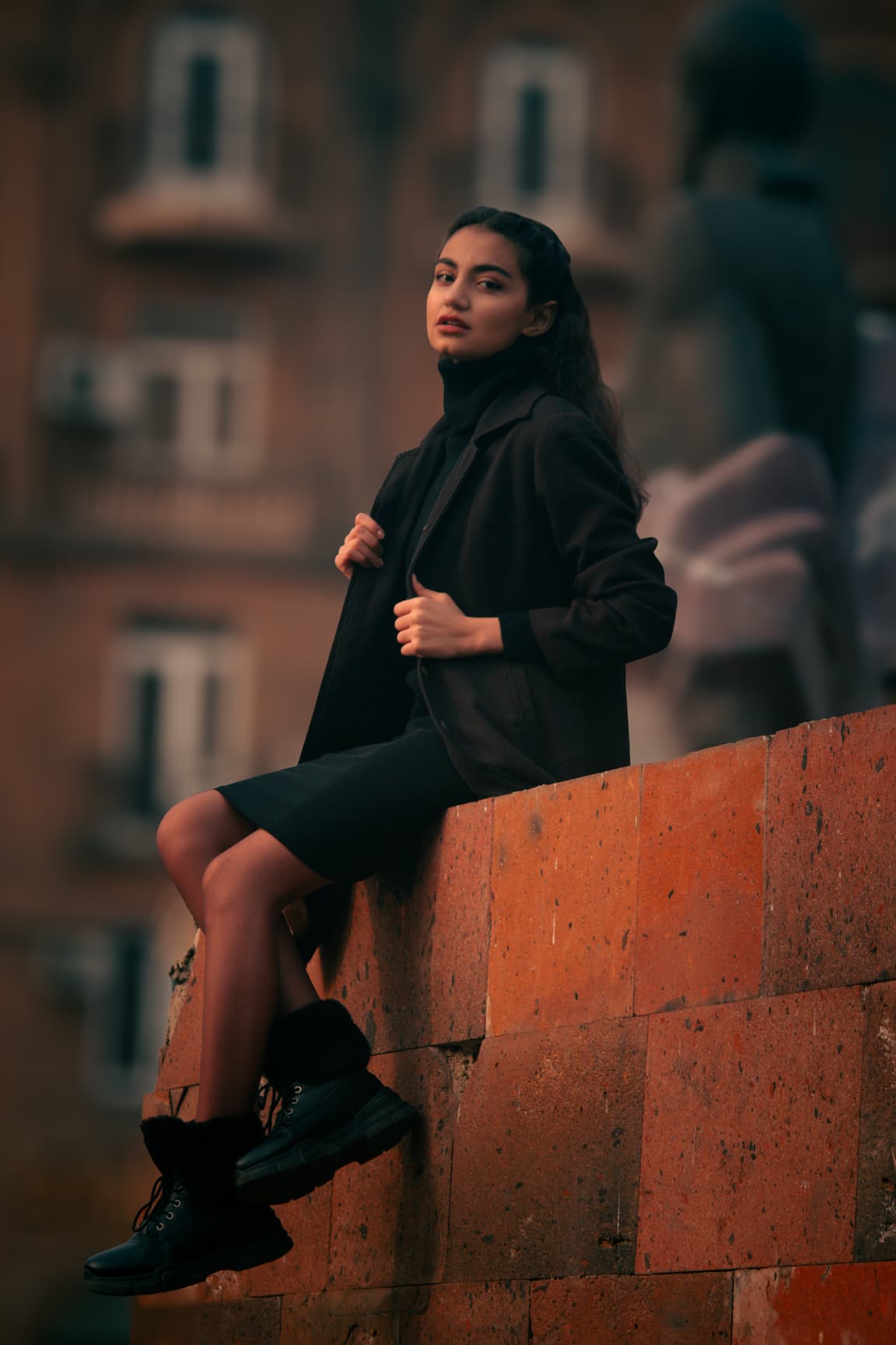 a person standing in front of a rock formation